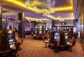 Live casino blackjack table with dealer and multiple players